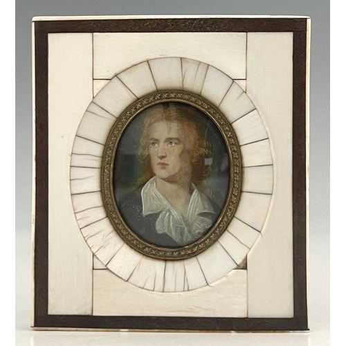 300 - A pair of 18th-century portrait miniatures finely painted to depict a bewigged man in a purple velve... 