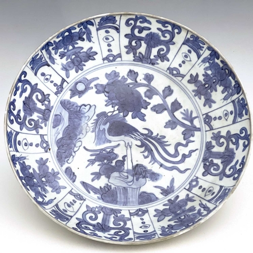 347 - A Chinese famille verte dish, Ming, circular form, painted with a central landscape within an iron r... 