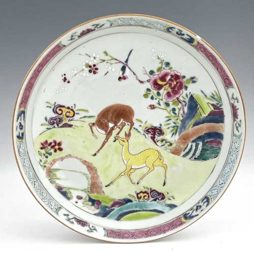 378 - A Chinese famille rose dish, enamelled with deer in a garden landscape, within geometric and foliate... 