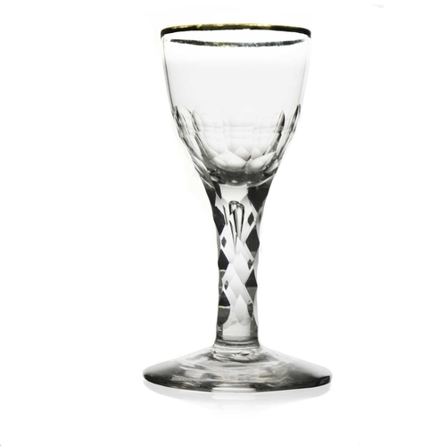 495 - A facet stem wine glass, circa 1780, the rounded bowl with silvered rim, half cut to the lower secti... 