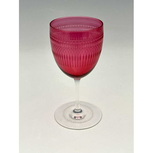 517 - James Powell and Sons, Whitefriars, an Etruscan Revival cranberry and colourless wine glass, circa 1... 