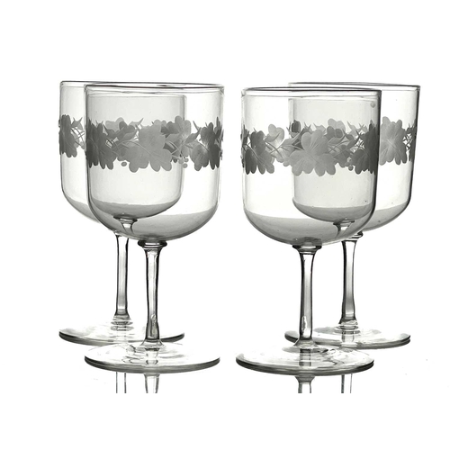 530 - A set of four Arts and Crafts wine glasses, probably John Walsh Walsh circa 1900, the cylindrical bo... 