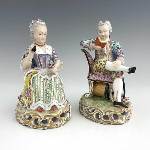 597 - A pair of Meissen type figures, probably late 18th century, model 137, modelled as a seated woman wi... 