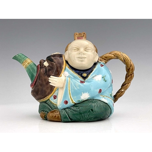 610 - A Minton majolica Aesthetic Movement Chinaman teapot, circa 1860s, modelled in relief with turquoise... 