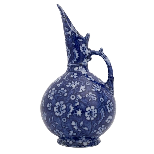 614 - An Aesthetic Movement blue and white jug, Keeling and Co., in the style of Christopher Dresser, sphe... 