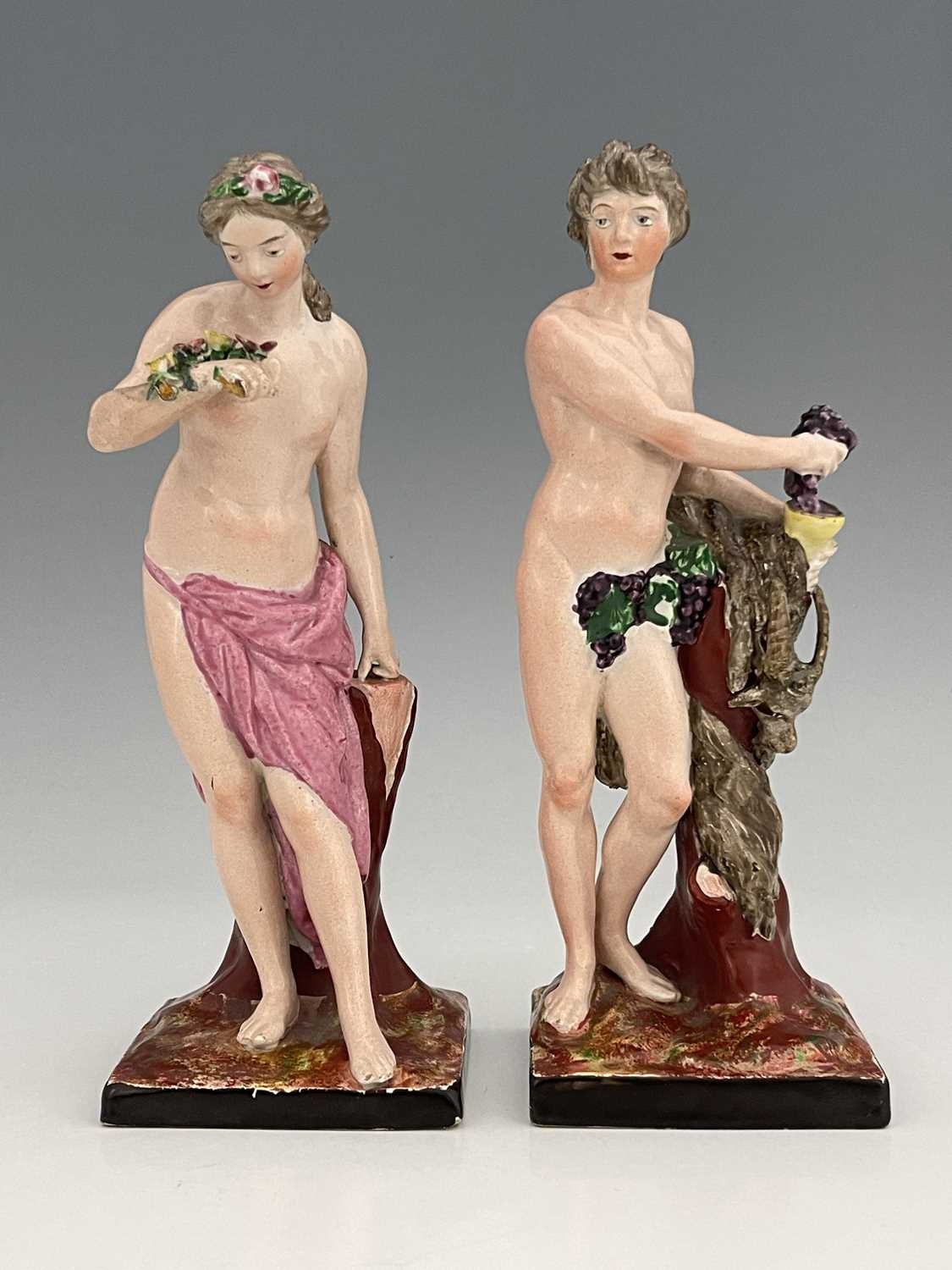 A Pair Of Staffordshire Pottery Figures Of Ariadne And Dionysus