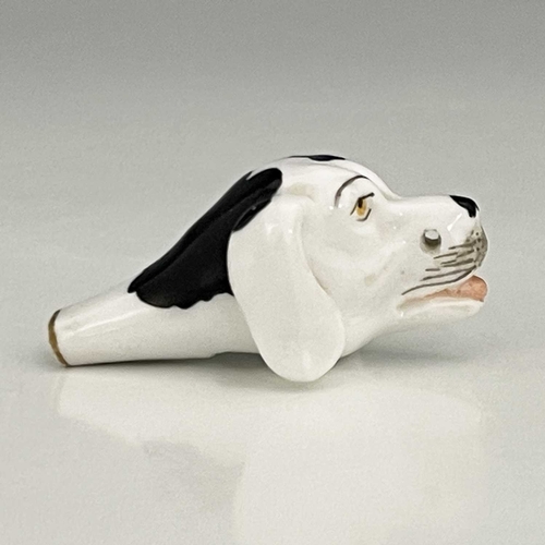 739 - A Staffordshire porcelain novelty dog whistle, 19th century, modelled in the form of a spaniel's hea... 