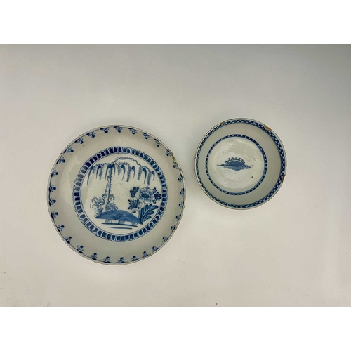 742 - A London Delft blue and white dish and bowl, the large shallow dish painted with weeping willow and ... 