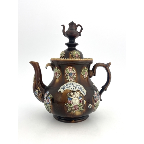 745 - A large Measham Bargeware teapot, circa 1880, baluster form, decorated with flower and foliate sprig... 