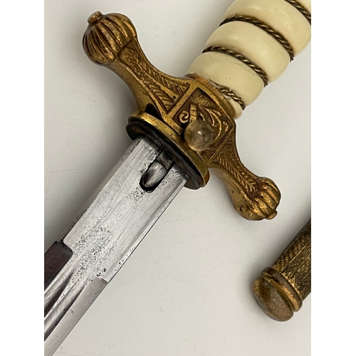 312 - A German Third Reich Naval Officer's dagger, gilt eagle finial, wire-bound white plastic grip, ancho... 