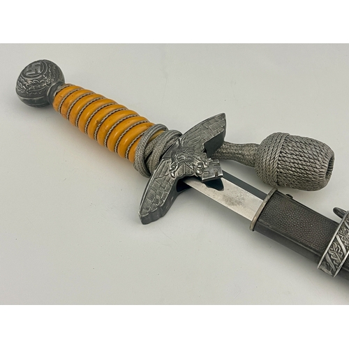 314 - A German Third Reich Luftwaffe dagger, 2nd Model, wire bound orange plastic grip, eagle crossguard, ... 