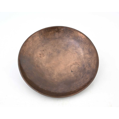 109 - Gordon Russell, an Arts and Crafts copper Lygon dish, planished shallow concave form on three domed ... 