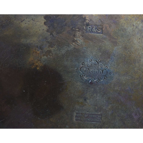 109 - Gordon Russell, an Arts and Crafts copper Lygon dish, planished shallow concave form on three domed ... 