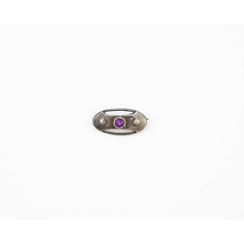 29 - Charles Horner, an Arts and Crafts silver and purple stone brooch, Chester circa 1910, oval form wit... 