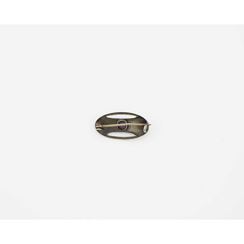 29 - Charles Horner, an Arts and Crafts silver and purple stone brooch, Chester circa 1910, oval form wit... 