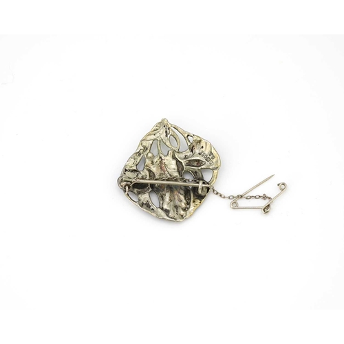 30 - An Art Nouveau silver and enamelled brooch, cast and reticulated in the form of an iris, with polych... 