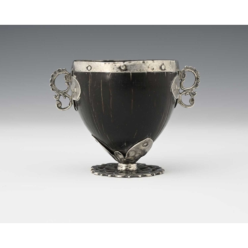 56 - An 18th century Spanish Colonial 'coco chocolatero' white metal mounted chocolate cup, the coconut b... 