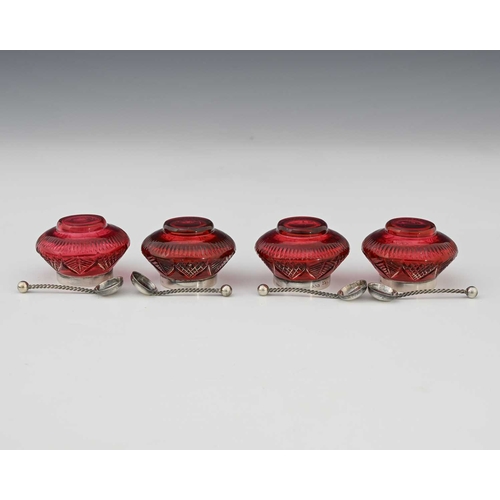57 - A set of four Aesthetic Movement silver mounted and cut ruby glass salt cellars, Saunders and Shephe... 