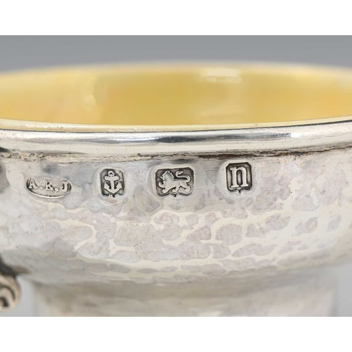 68 - A E Jones and Ruskin Pottery, an Arts and Crafts twin handled silver and ceramic lined salt cellar, ... 