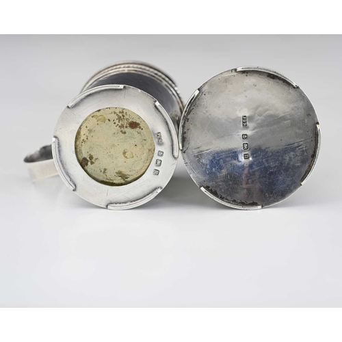 72 - John Sidney Reeve, an Arts and Crafts silver two piece cruet set, Birmingham 1912, the pepper pot of... 