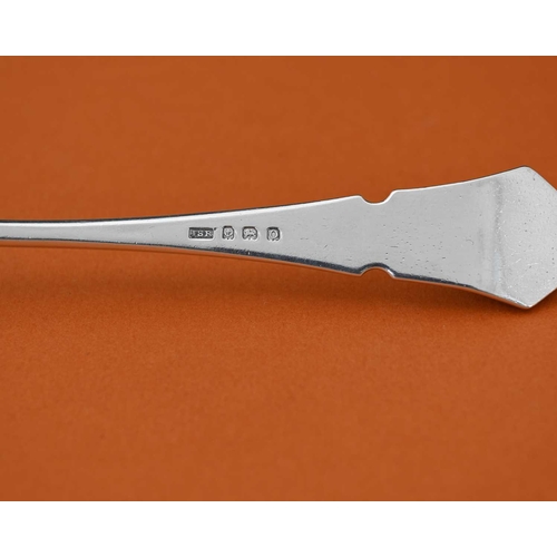 77 - John Sidney Reeve, an Arts and Crafts silver spoon, Birmingham 1938, the planished rounded bowl with... 