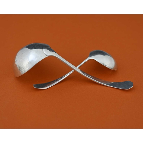 79 - John Sidney Reeve, two Arts and Crafts silver ladles, Birmingham 1931, each with angled point and li... 