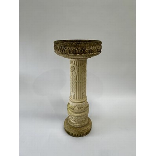 1003 - A sandstone composite birdbath with Roman numerals dial and front figurine, measuring 81.5cm high an... 