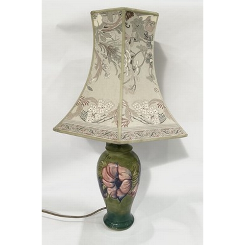 116 - A large Moorcroft Clematis flower motif on green gradient background lamp, with lampshade, maker's s... 