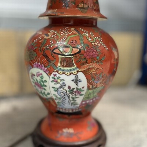 121 - A Chinese export table lamp, featuring an oriental country scene set on an orange ground with gilt, ... 