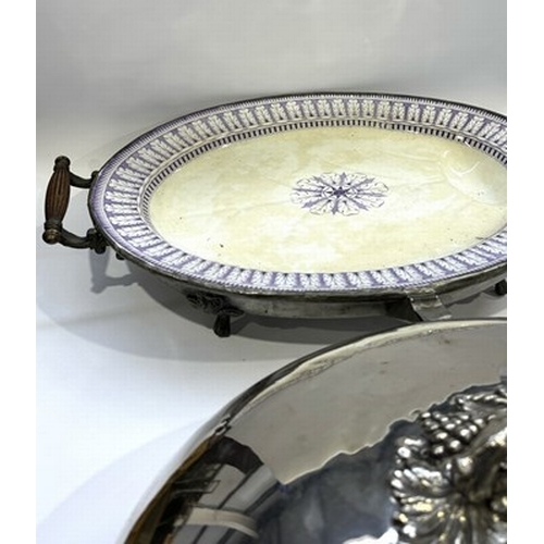 133 - A 19th century plated domed footed serving platter with elaborately cast naturalistic handle decorat... 