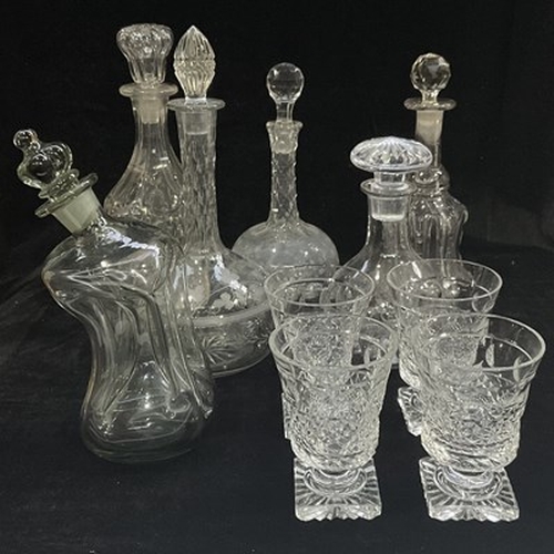 135 - A collection of glassware: a large flower bowl, four square-footed cut glass wine rummers, and decan... 