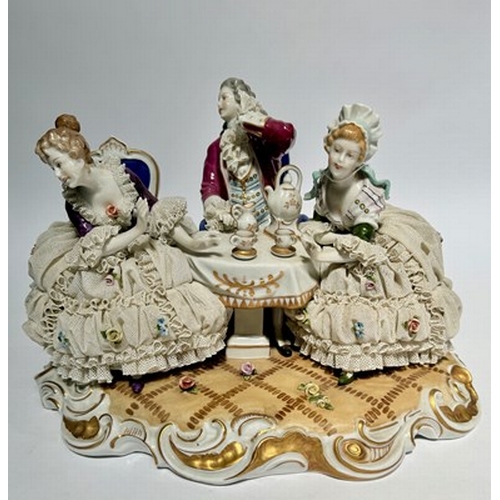 147 - A large Unter Weiss Bach porcelain figure group of two ladies and a gentleman in 18th-century dress,... 