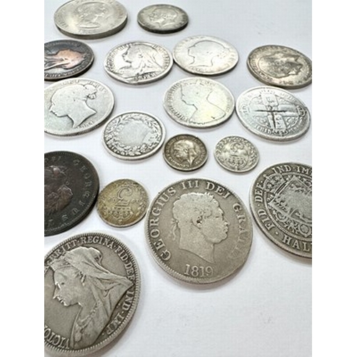 15 - A collection of coins including a George III 1807 and Victoria penny, five pre-1921 silver half crow... 