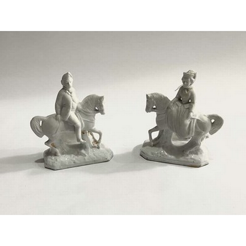 151 - A pair of white Dresden porcelain figurines modelled as a man and woman on horseback (2)