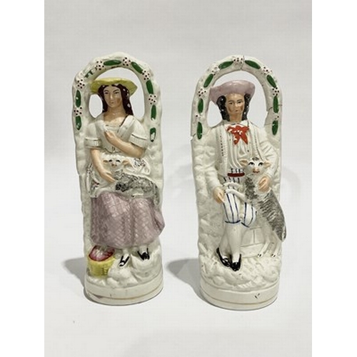 166 - A pair of Staffordshire style figurines, circa late 19th century, with gilt detailing, approx 25cm h... 