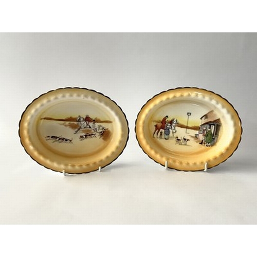 194 - A pair of Royal Doulton 'scene' dishes, featuring hunting scenes on a gradient yellow ground with gr... 