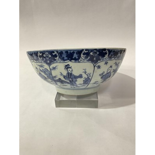 213 - A Chinese blue and white bowl, footed form, painted with panels of boys within a foliate border, 24c... 