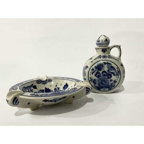 215 - A Delft, hand-painted falcon, circa 1990s, blue motifs of floral and bird design, set on a cream bac... 