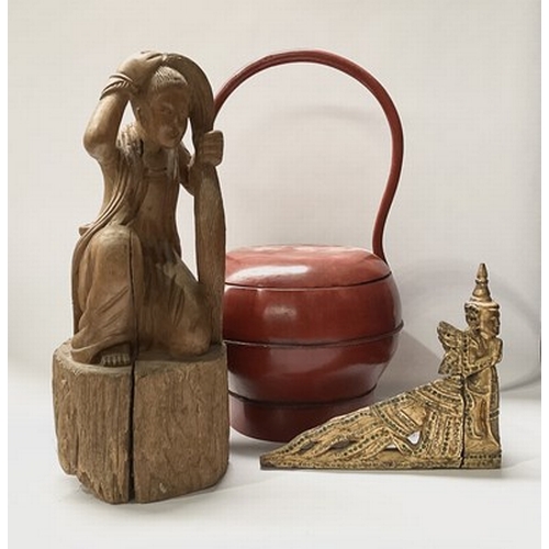 23 - A collection of red lacquerware, Hindu bronze figurines, a Thai bodhisattva corner pediment and a ca... 