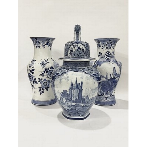 230 - A trio of Royal Delft Large vases, in white and blue with floral motifs, to include a ginger jar and... 