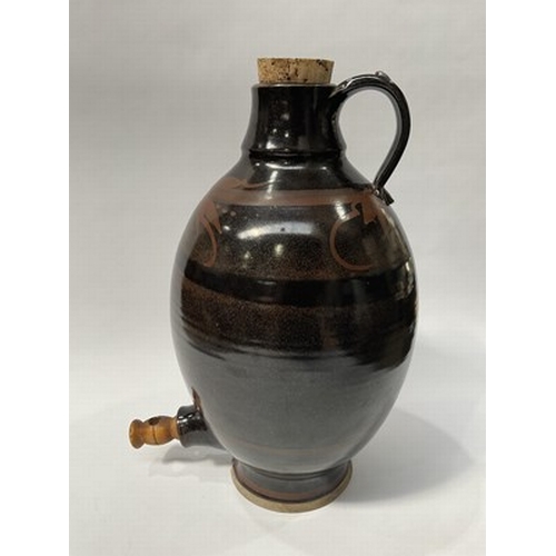 231 - A large studio pottery cider tap, decorated in an iron-based glaze with foliate banding, impressed p... 