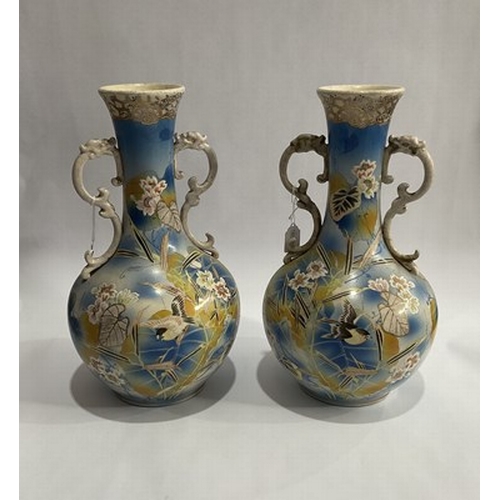 232 - A pair of Japanese Satsuma twin handled vases, light blue ground (2)