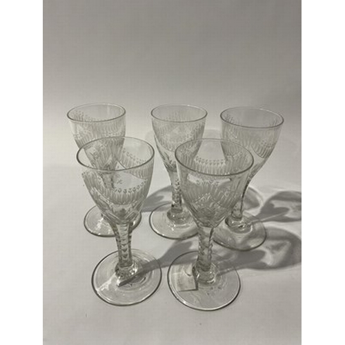 257 - Five George III Neoclassical wine glasses, circa 1790, the rounded conical bowls engraved with swags... 