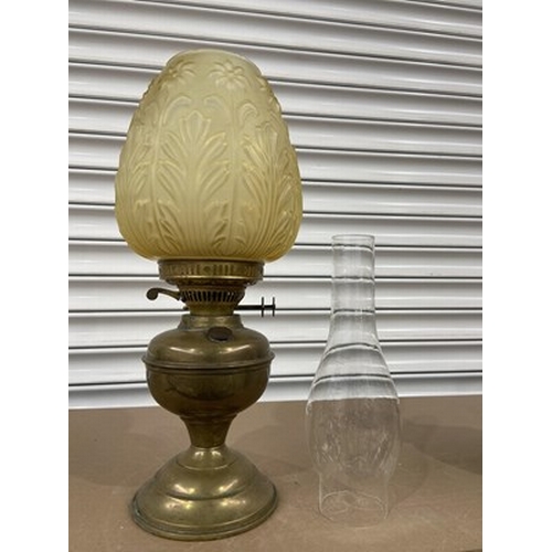 275 - A Victorian brass and amber moulded glass shade oil lamp, Aesthetic Movement style, 43cm high