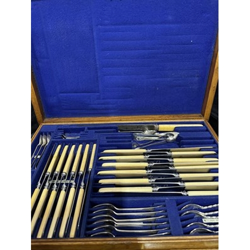 287 - A case of plated flatware retailed by Army and Navy together with a 5-drawer spice cabinet (2)