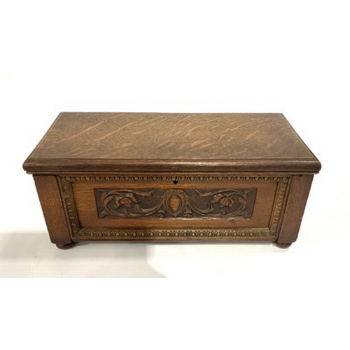 288 - An Edwardian oak table casket, hinged cover, carved front and sides within an egg and dart border, 3... 