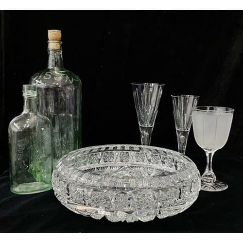 44 - A large cut crystal fruit bowl and platter, together with a pair of crystal teardrop champagne flute... 