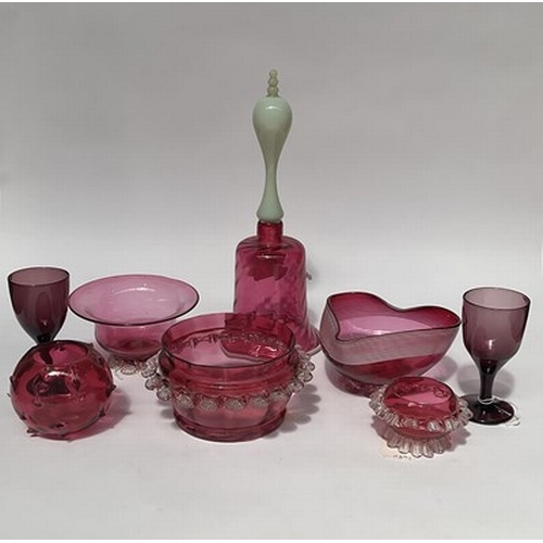 49 - A Victorian and later cranberry glass including opaline handled bell, carafe, opaque threaded bowl, ... 