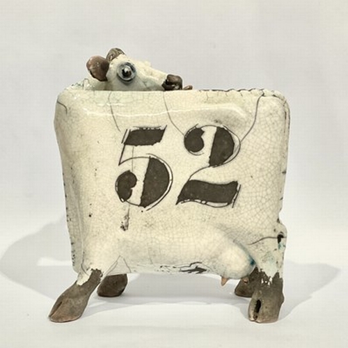 515 - Lawson E. Rudge (British, b.1936), Studio Pottery: A Raku fired Licking Flat Ceramic Cow, spot patte... 