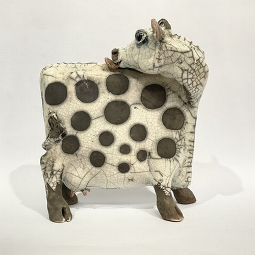 515 - Lawson E. Rudge (British, b.1936), Studio Pottery: A Raku fired Licking Flat Ceramic Cow, spot patte... 